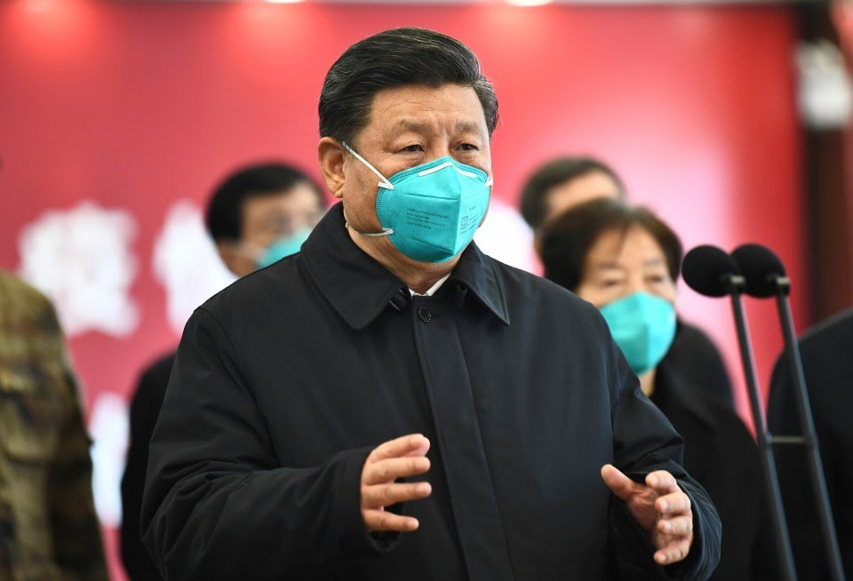 China's President Xi Jinping talks by video with patients and medical workers at the Huoshenshan Hospital in Wuhan in March