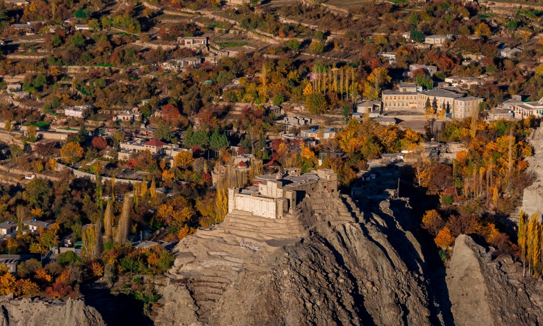 Baltit Fort stands as a timeless sentinel amidst the vibrant tapestry of autumn