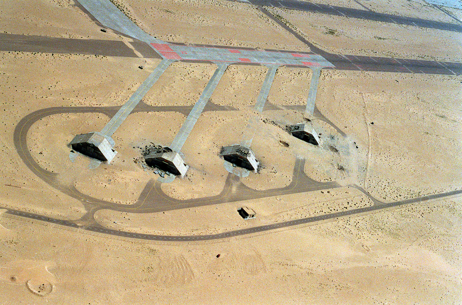an-aerial-view-of-four-hardened-aircraft-shelters-at-kuwait-international-airport-6f02e2-1600.jpg