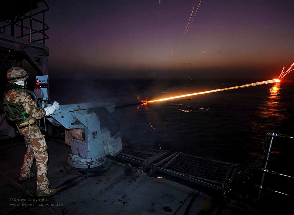 the-hms-cornwall-was-decommissioned-in-2011-it-was-primarily-involved-in-counter-piracy-missions-here-a-soldier-shoots-the-cornwalls-20mm-close-range-guns-during-a-night-firing-exercise.jpg