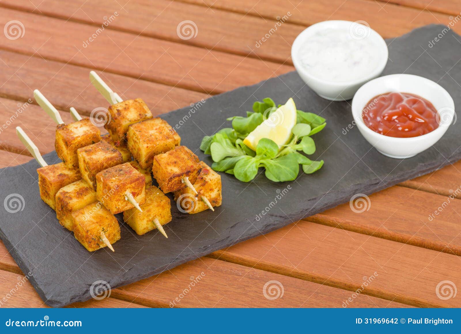 paneer-tikka-kebab-tandoori-indian-cheese-skewers-served-slate-lemon-chili-sauce-cucumber-red-onion-yoghurt-31969642.jpg