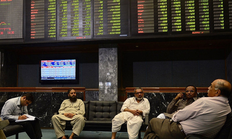 Stockbrokers are seen at the Pakistan Stock Exchange (PSX) in this file photo. — AFP