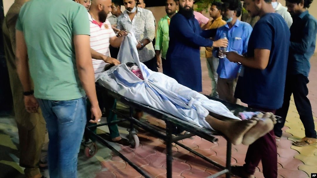 The body of Ibris Khan, 28, who went missing on April 10 during violence in Khargone and found a week later, is carried on a stretcher outside a mortuary in Indore, the central Indian state of Madhya Pradesh, April 18, 2022.