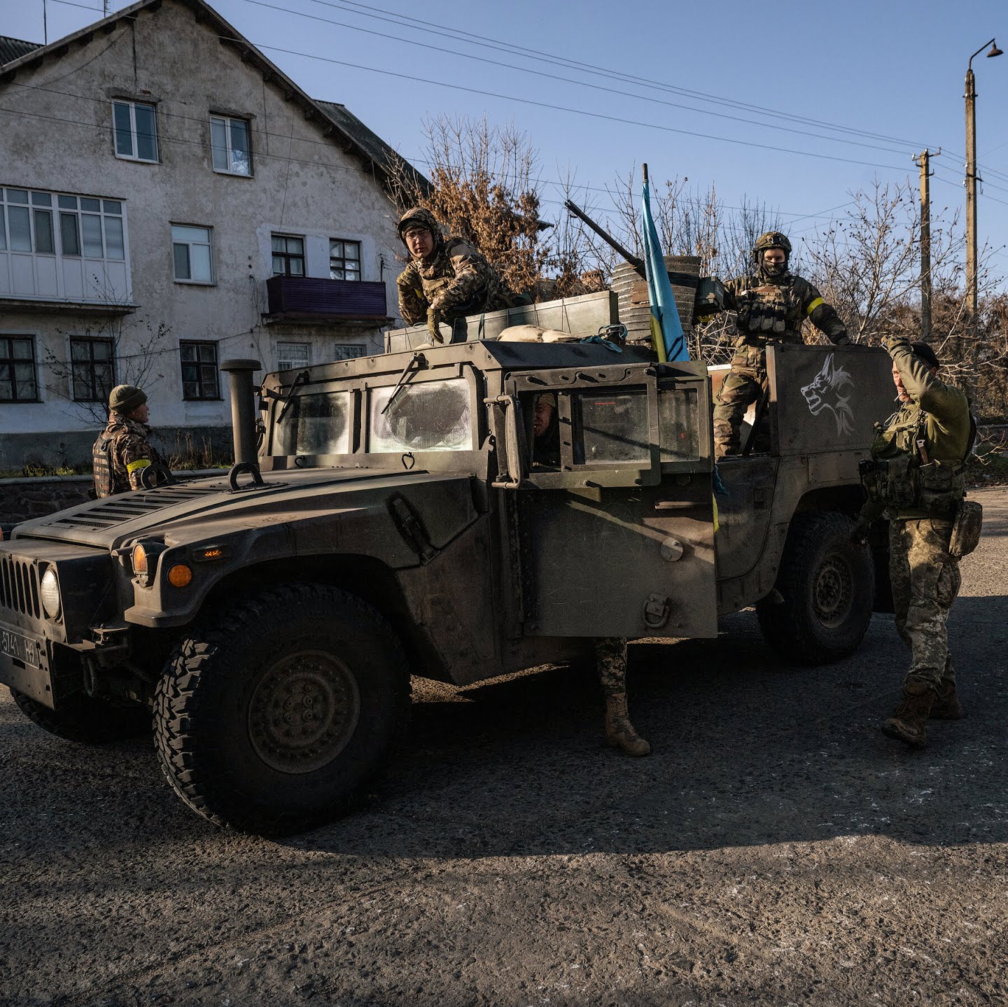 Ukrainian soldiers in the village of Snihurivka, in southern Ukraine, on Thursday, the day after Russia formally announced it had retreated from villages along the Kherson front.