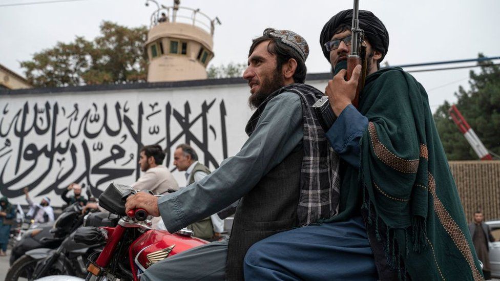 Taliban fighters patrol the streets in Kabul on the anniversary of the fall of Afghanistan to the Taliban