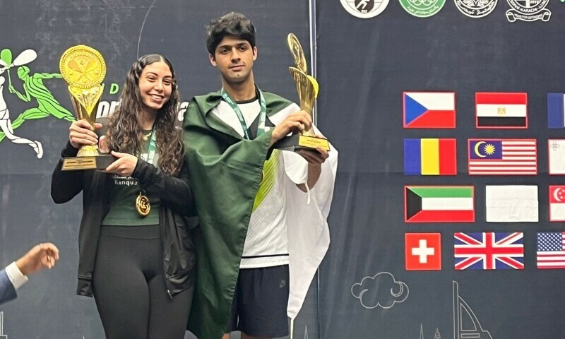Noor Zaman and Egypt’s Fayrouz Abouelkheir celebrate after winning the men’s and women’s title at the U23 World Squash Championship in Karachi on Thursday. — Photo by author