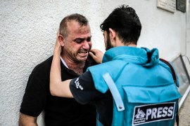 Family members mourn the killing of 19-year-old Noor Zweidi from Beit Hanon after he was targeted in front of his house in the northern Gaza Strip in an Israeli air raid [Hosam Salem/Al Jazeera]