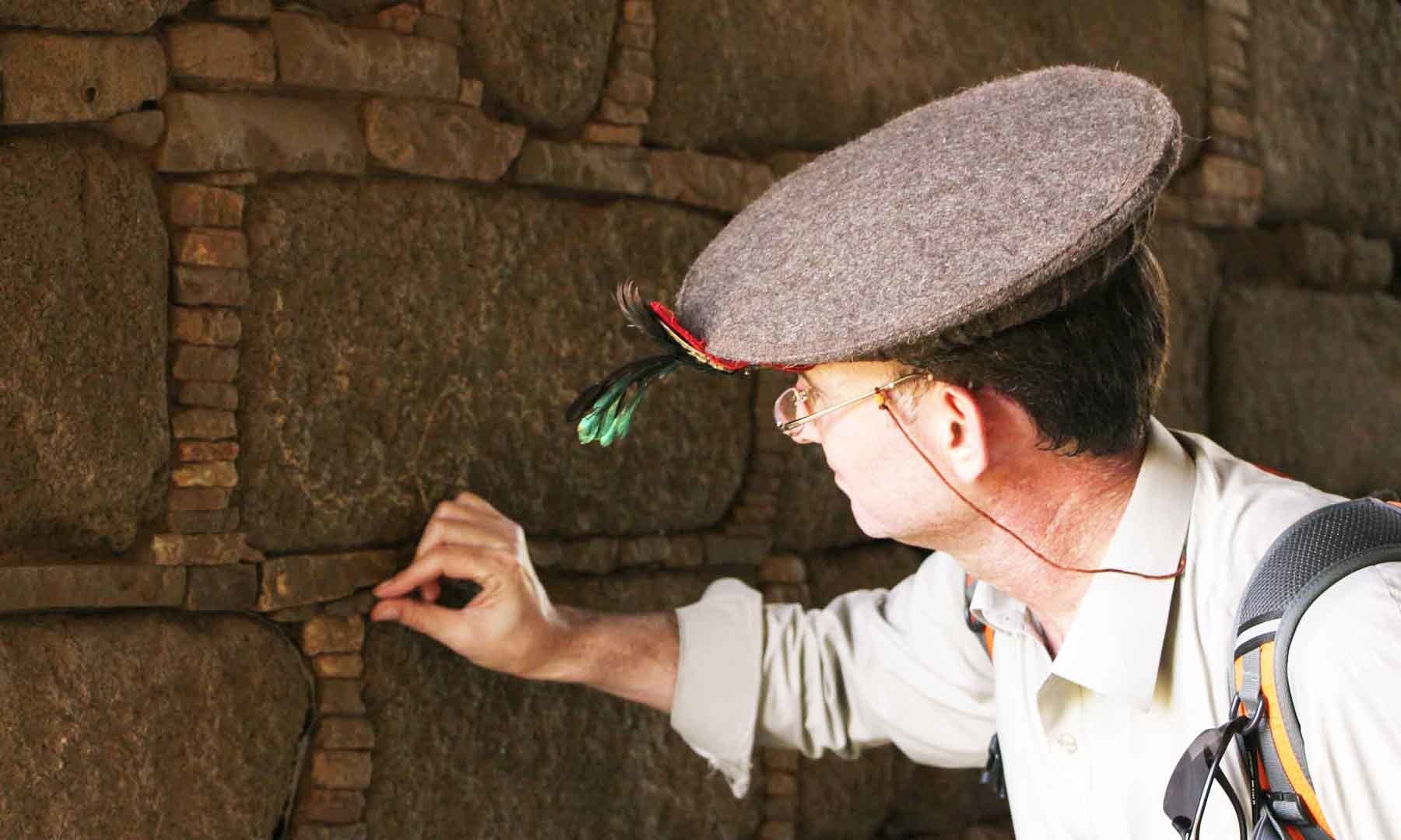 A tourist inspects artifacts inside the Queen's Palace; photo by Amjad Ali Sahab