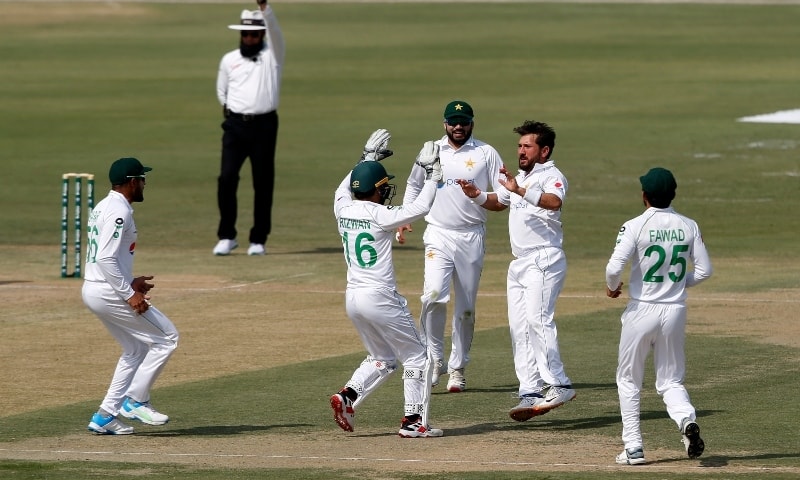 Pakistan's spinner Yasir Shah, second from right, celebrates with teammates on the dismissal of South Africa's batsman Faf du Plessis during the first day of the first cricket test match between Pakistan and South Africa at the National stadium on Jan 26. — AP