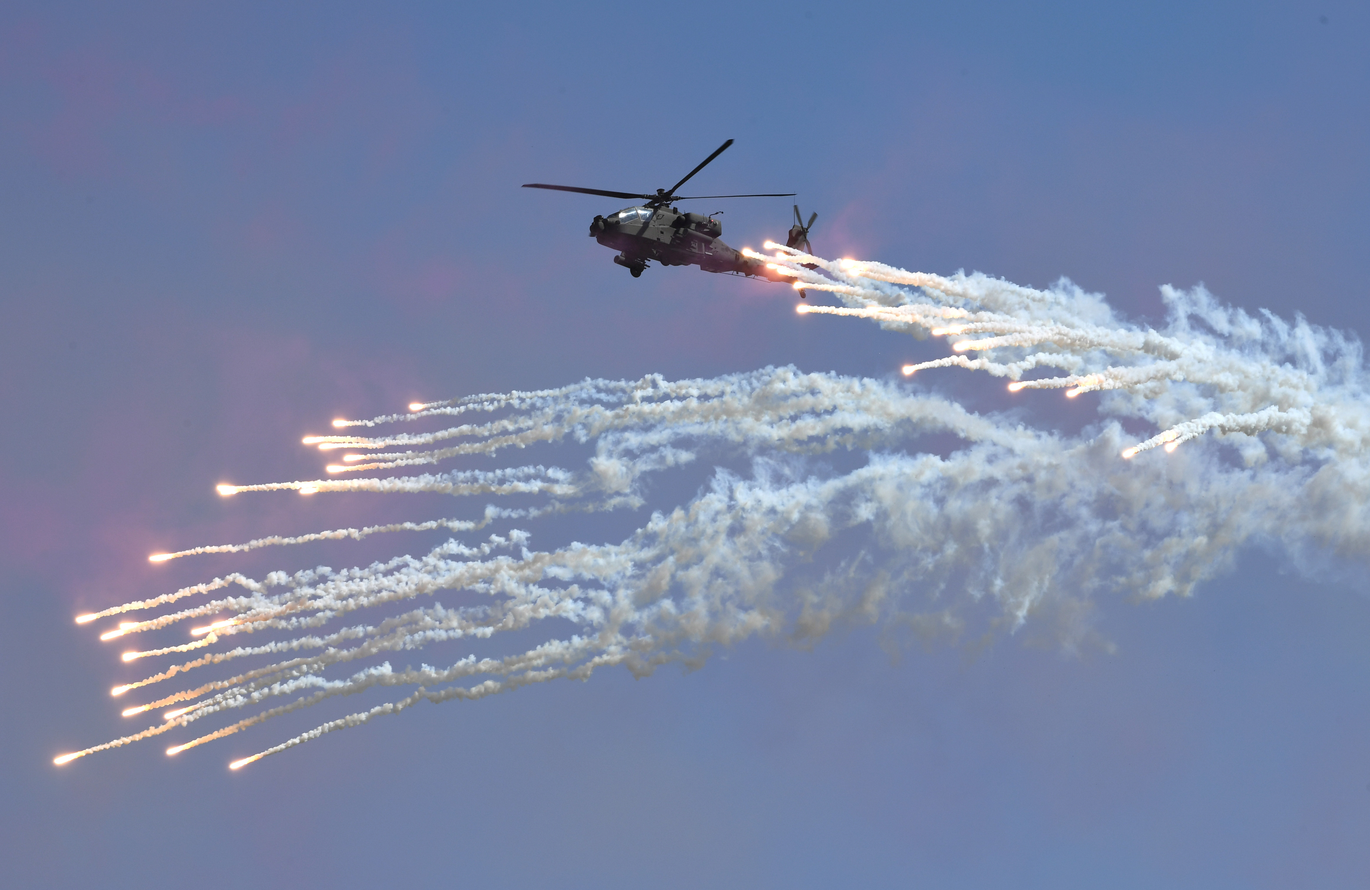 A South Korean Navy Lynx helicopter fires flares during a commemoration ceremony marking South Korea's Armed Forces Day in Pyeongtaek