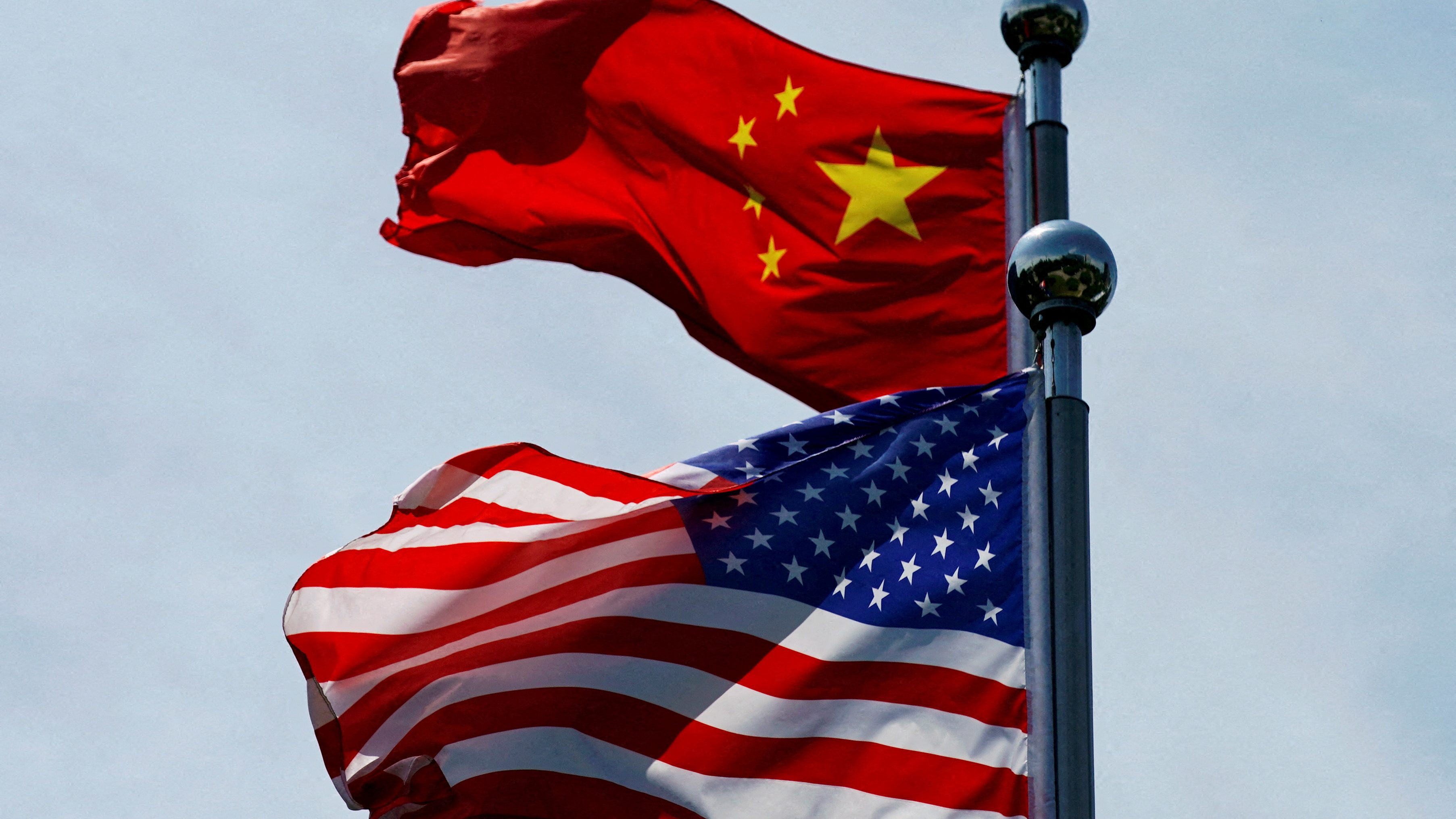 Chinese and U.S. flags flutter near The Bund in Shanghai