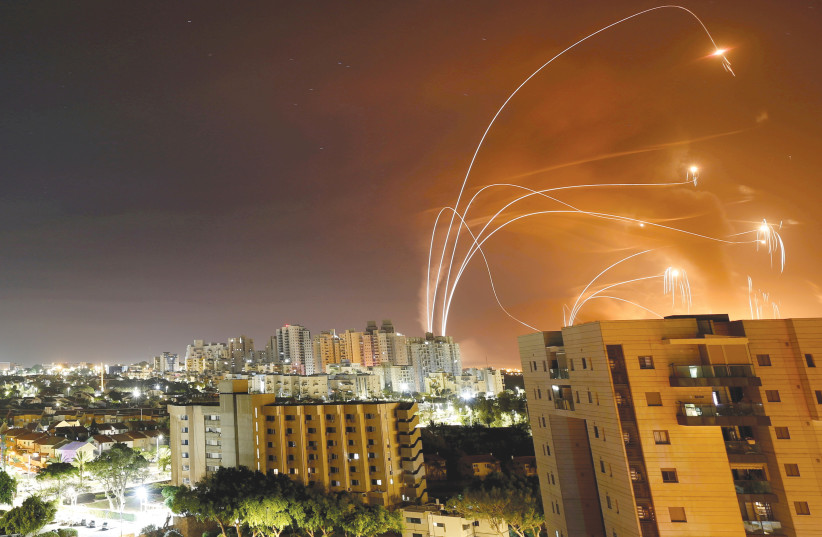  IRON DOME interceptors destroy rockets launched from the Gaza Strip toward Israel in the skies over Ashkelon in May. (credit: AMIR COHEN/REUTERS)