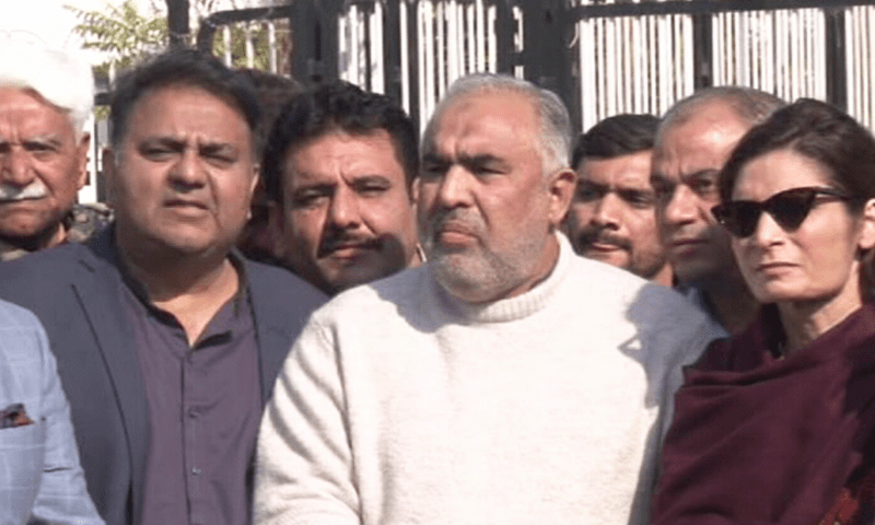   PTI leaders speak to media outside the National Assembly building on Friday. — DawnNewsTV