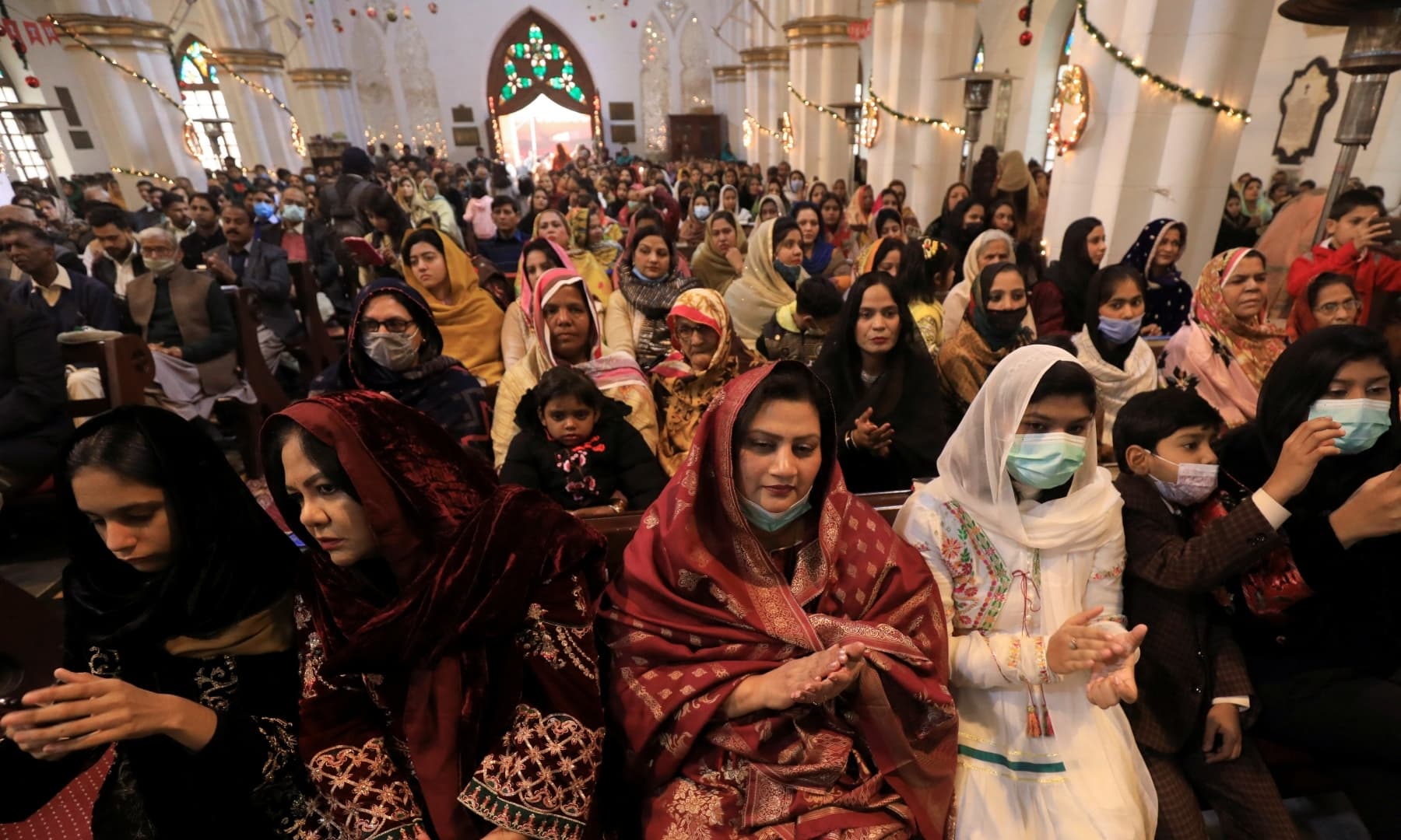 People attend a Christmas Day service at the St John's Cathedral in Peshawar on December 25, 2021. — Reuters