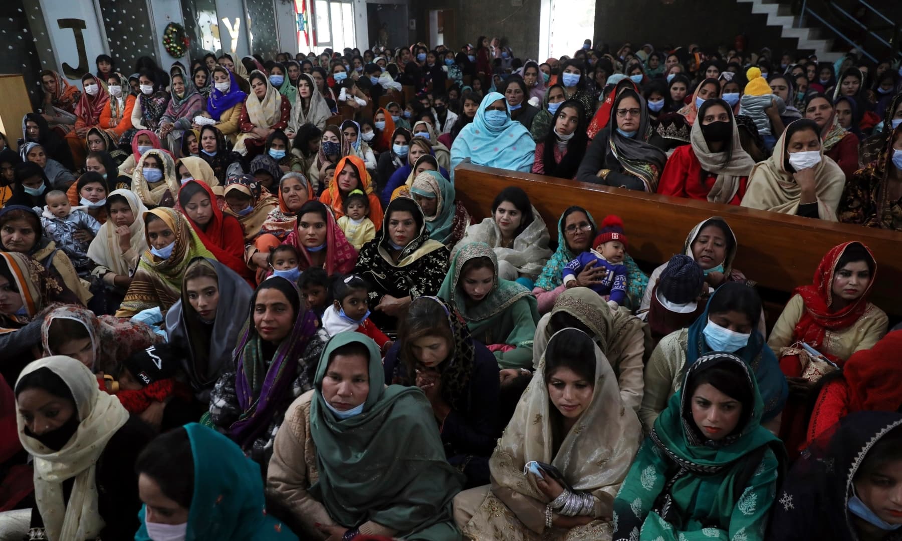 People attend a Christmas Mass in Our Lady of Fatima Church in Islamabad on December 25, 2021. — AP