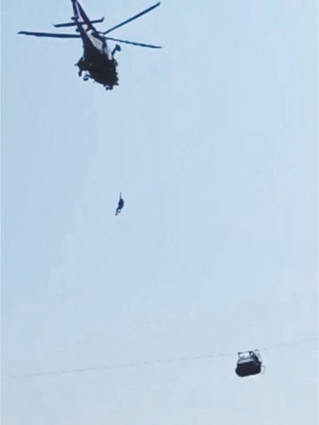  The dramatic rescue mission of students stuck in a chairlift in Khyber Pakhtunkhwa gripped the nation on August 23. The helicopter was able to rescue one student before it had to suspend operations. The remaining passengers were rescued by ziplines | AFP 