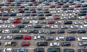 Hundreds of cars wait in line at a food distribution event amid the coronavirus outbreak in Austin, Texas, last month.