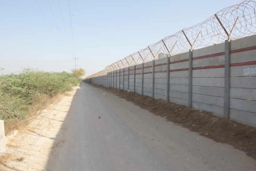 A wall constructed by Bahria Town Karachi near Gabol village.