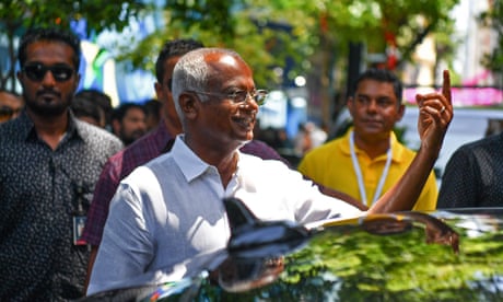Ibrahim Mohamed Solih, the Maldives president, shows his ink-marked finger after casting his ballot during the first round of the presidential election