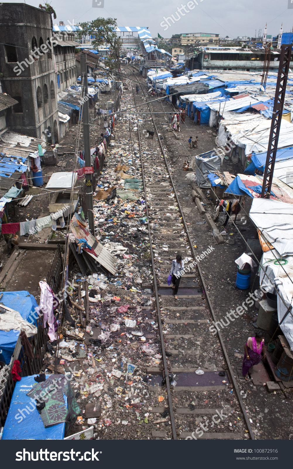 stock-photo-mumbai-august-unidentified-poor-people-living-in-slum-at-august-in-mumbai-india-100872916.jpg
