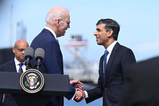Joe Biden and Rishi Sunak are set to discuss AI in Washington (PA Wire)