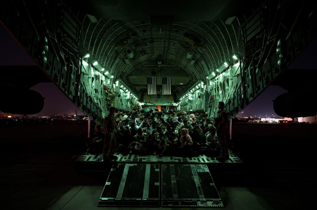 Evacuees aboard a US Air Force C-17 Globemaster III aircraft during the Afghanistan evacuation from Kabul on August 21, 2021.