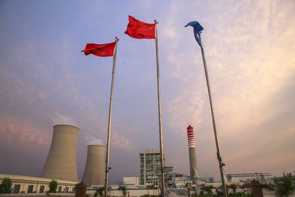 A Chinese national flag, center at the Sahiwal coal power plant in Pakistan, which cost about $1.9 billion to build. Pakistan now owes around $119 million in back payments to Chinese companies just for operating the plant.