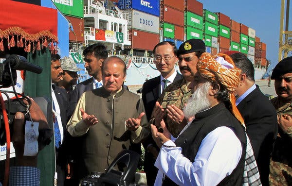 Prime Minister Nawaz Sharif of Pakistan, center left, praying during the formal opening of Gwadar port in 2016.