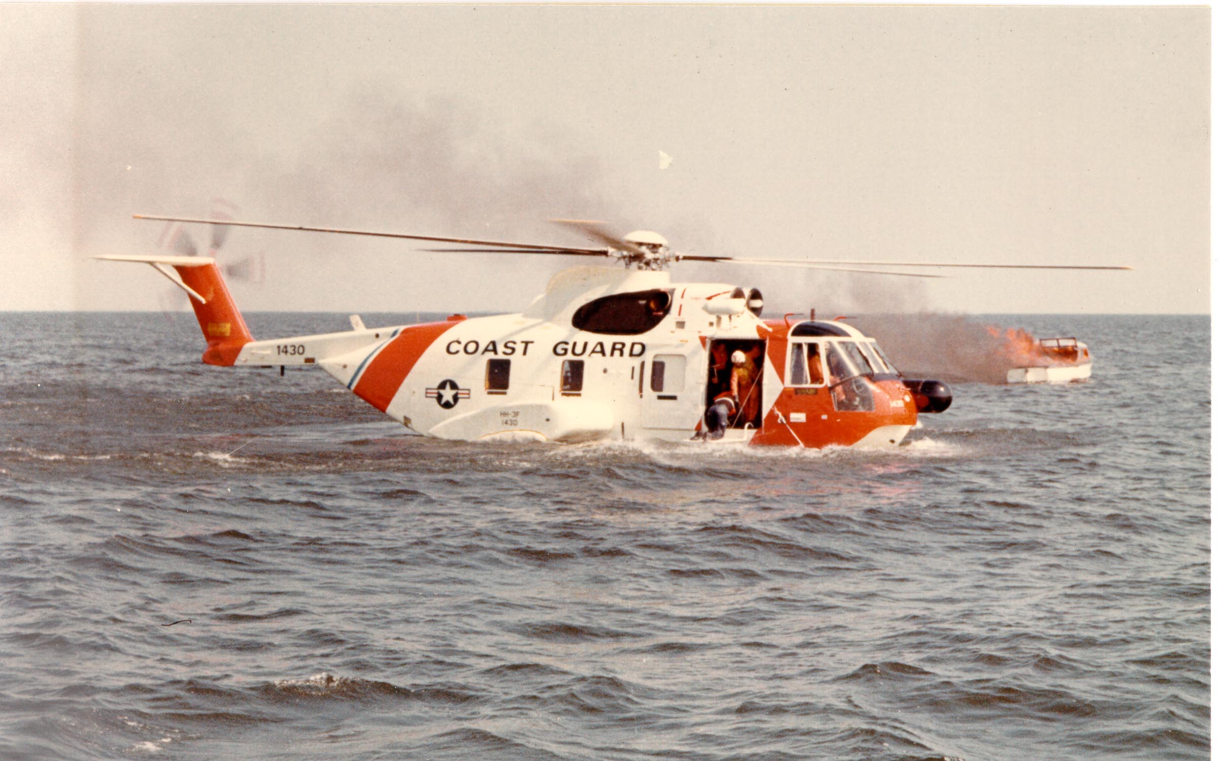 HH-3F_Pelican_on_the_water_with_a_burning_boat.jpg
