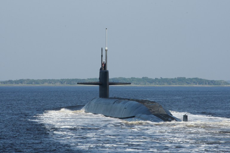 A photo of The Ohio-class ballistic-missile submarine USS Alaska (SSBN 732) coming out of the water.