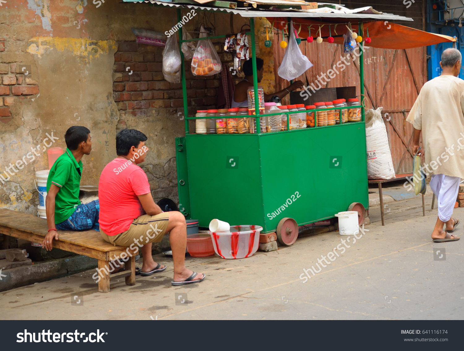 stock-photo-kolkata-india-april-people-sitting-outside-a-roadside-tea-stall-641116174.jpg